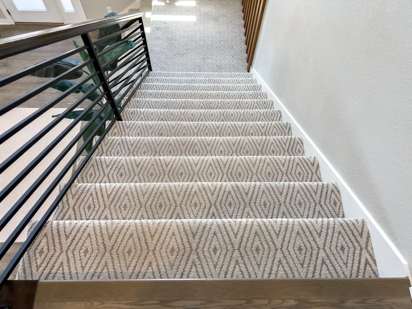 Patterned carpet runner on a staircase in a Northwest Iowa home